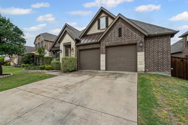 view of front of property with a front lawn, brick siding, concrete driveway, an attached garage, and fence