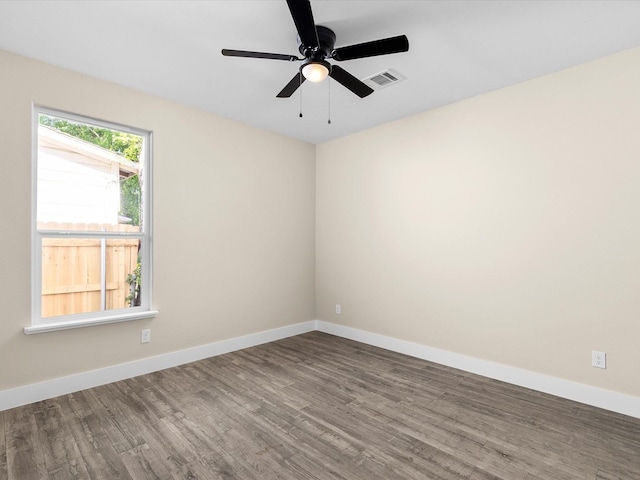 5525 Vesta Farley Rd, Fort Worth, TX 76119 - spare room with a ceiling fan, visible vents, wood finished floors, and baseboards