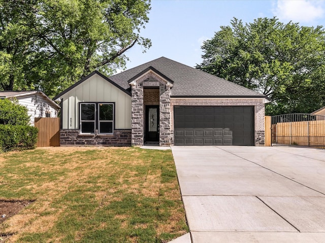 5525 Vesta Farley Rd, Fort Worth, TX 76119 - view of front of home featuring board and batten siding, concrete driveway, a front yard, fence, and a garage