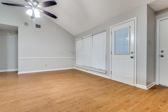 interior space featuring visible vents, ceiling fan, vaulted ceiling, and light wood-style floors