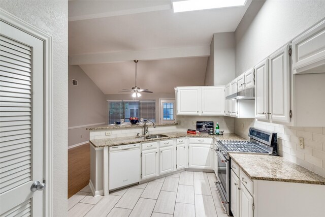 kitchen featuring tasteful backsplash, a sink, lofted ceiling with beams, stainless steel range with gas stovetop, and dishwasher