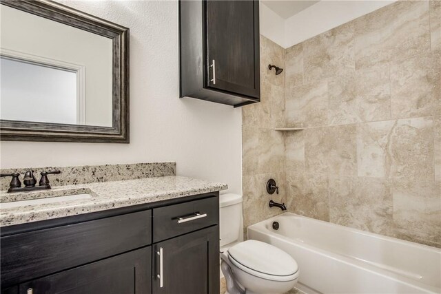10121 Budtime Ln, Dallas, TX 75217 - bathroom featuring vanity, bathtub / shower combination, and toilet