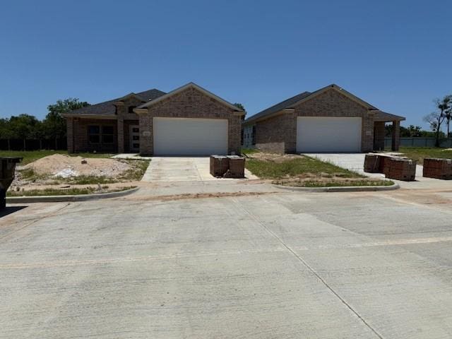 10121 Budtime Ln, Dallas, TX 75217 - ranch-style home featuring a garage and driveway