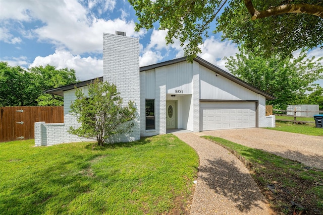 mid-century inspired home featuring a chimney, fence, driveway, and a front yard