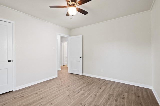 900 W Coffin St, Denison, TX 75020 - unfurnished room with light wood-style floors, baseboards, ceiling fan, and crown molding