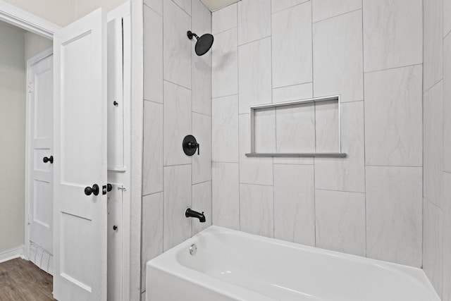 900 W Coffin St, Denison, TX 75020 - full bath with bathtub / shower combination and wood finished floors