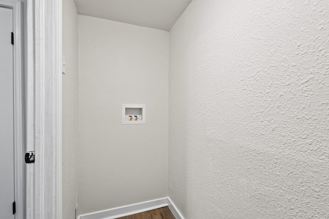 900 W Coffin St, Denison, TX 75020 - laundry area featuring washer hookup, dark wood-style flooring, and baseboards
