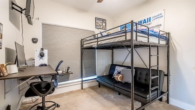 bedroom with carpet flooring and baseboards