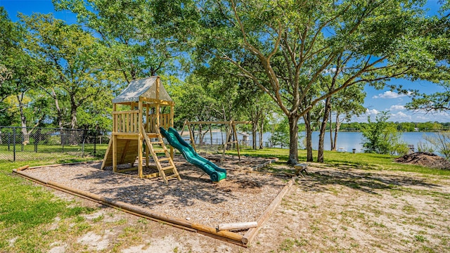 view of playground with fence and a water view
