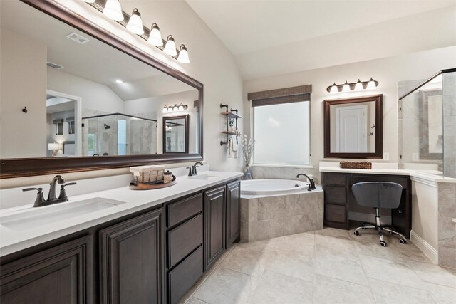 bathroom featuring a sink, a shower stall, and lofted ceiling