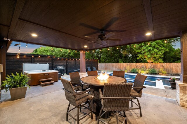view of patio / terrace with a fenced in pool, ceiling fan, a fenced backyard, and a hot tub