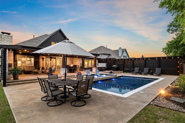 view of swimming pool featuring a patio, a fenced in pool, outdoor lounge area, outdoor dining area, and fence