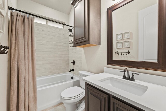 bathroom with shower / bath combo, vanity, and toilet