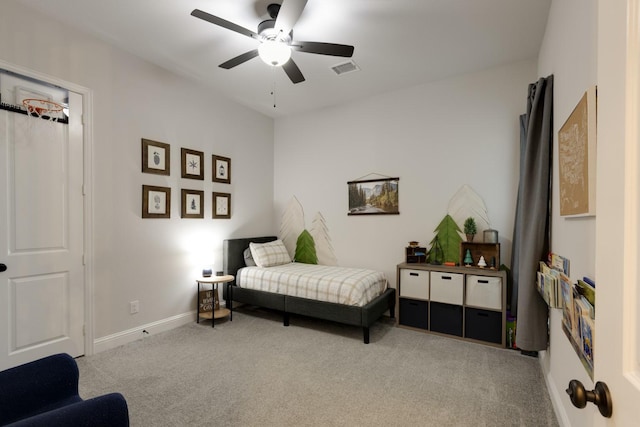 carpeted bedroom with baseboards, visible vents, and ceiling fan