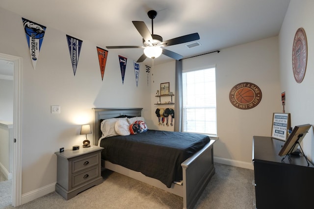 bedroom with light colored carpet, baseboards, visible vents, and ceiling fan
