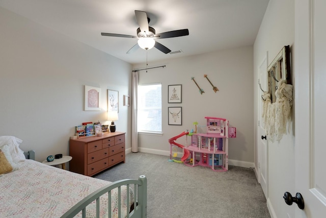 carpeted bedroom with baseboards, visible vents, and ceiling fan