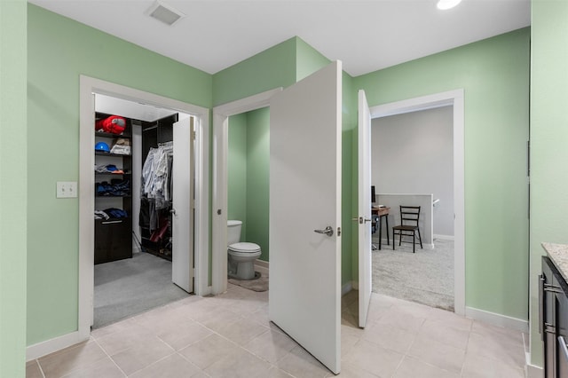 2608 Museum Way Unit 3407, Fort Worth, TX 76107 - full bathroom with tile patterned floors, toilet, visible vents, baseboards, and a spacious closet
