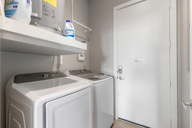2608 Museum Way Unit 3407, Fort Worth, TX 76107 - clothes washing area featuring light tile patterned flooring, washing machine and clothes dryer, and laundry area