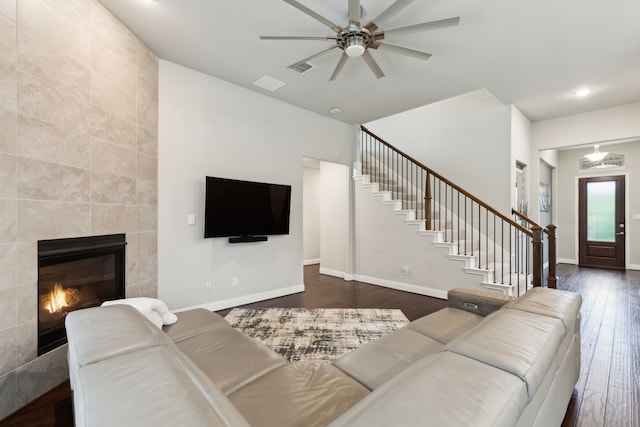living area with dark wood-style flooring, stairs, ceiling fan, baseboards, and recessed lighting
