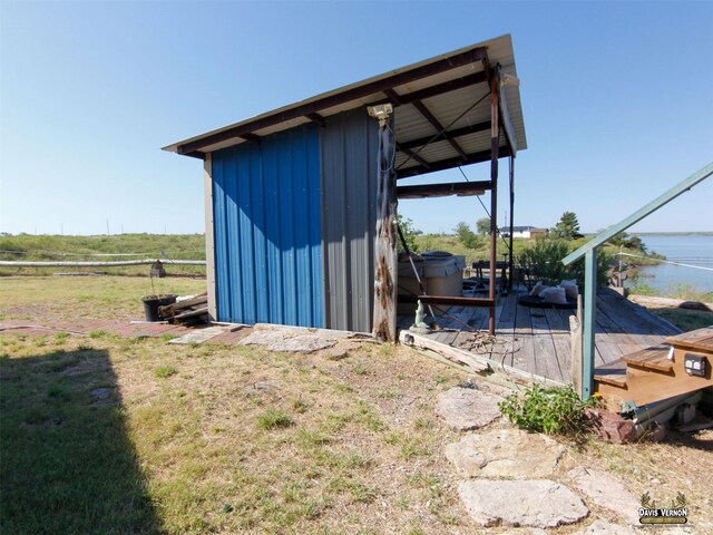 view of outbuilding with an outdoor structure and a carport
