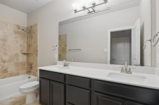 1331 Bailey Ln, Allen, TX 75013 - bathroom featuring toilet, double vanity, and a sink