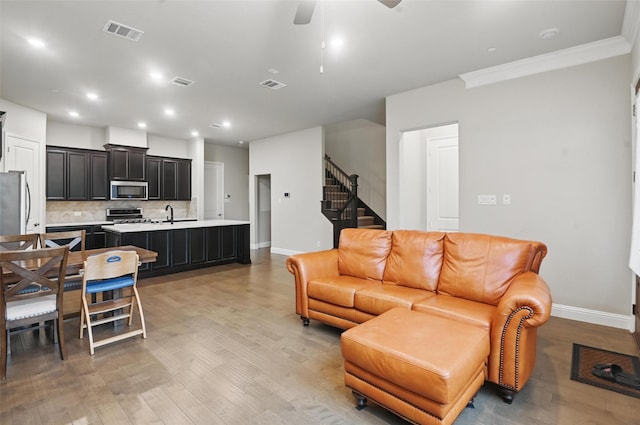 1331 Bailey Ln, Allen, TX 75013 - living room featuring visible vents, baseboards, and light wood-type flooring