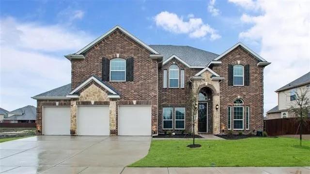 4502 Longbourn Dr, Mansfield, TX 76063 - traditional home with brick siding, fence, driveway, and a front yard