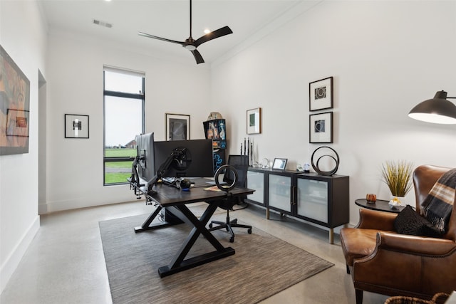 office area featuring visible vents, finished concrete flooring, and a healthy amount of sunlight