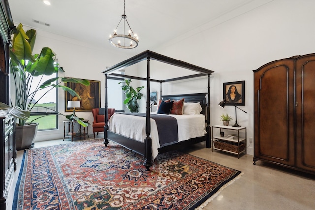 bedroom with a notable chandelier and concrete floors