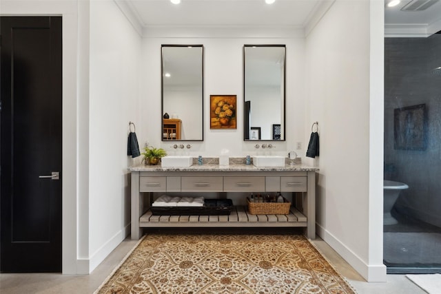 full bathroom with baseboards, recessed lighting, ornamental molding, and double vanity
