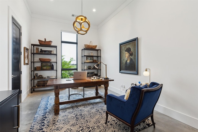 office space with finished concrete flooring, ornamental molding, and baseboards