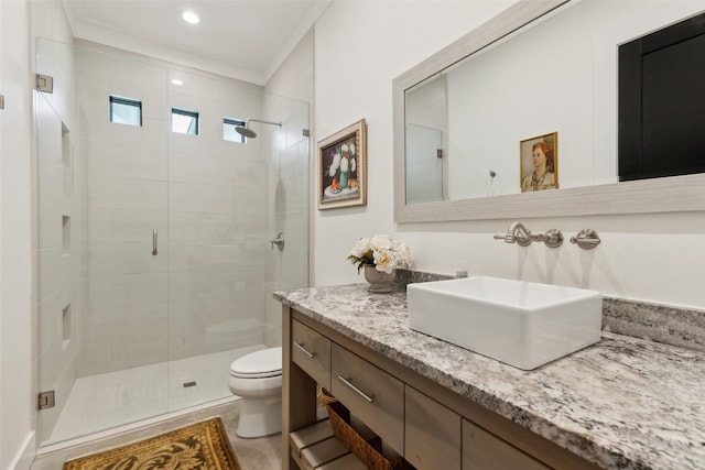 full bathroom featuring recessed lighting, a shower stall, toilet, vanity, and crown molding