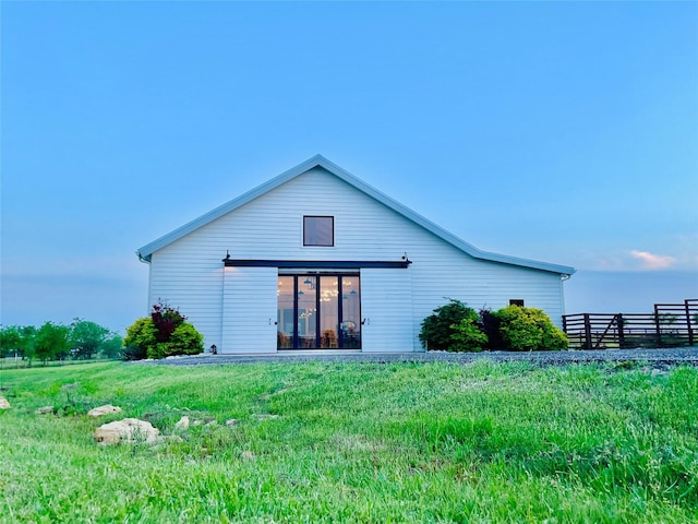back of house featuring fence