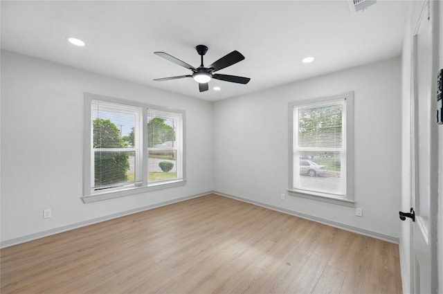 unfurnished room with light wood finished floors, recessed lighting, ceiling fan, visible vents, and baseboards