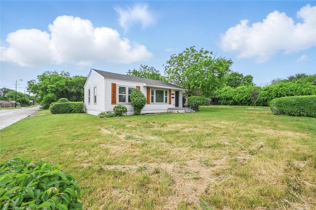 view of front of home with a front yard