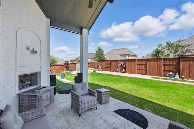 741 Almeda Ln, Prosper, TX 75078 - view of patio / terrace with an outdoor brick fireplace and a playground