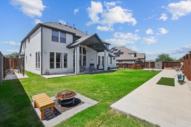 741 Almeda Ln, Prosper, TX 75078 - rear view of house with a patio area, a fire pit, a playground, a shed, and an outdoor structure