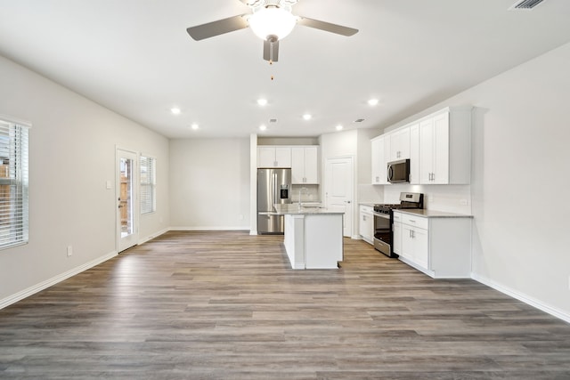 419 Bertney Dr, Princeton, TX 75071 - kitchen featuring recessed lighting, open floor plan, stainless steel appliances, and baseboards