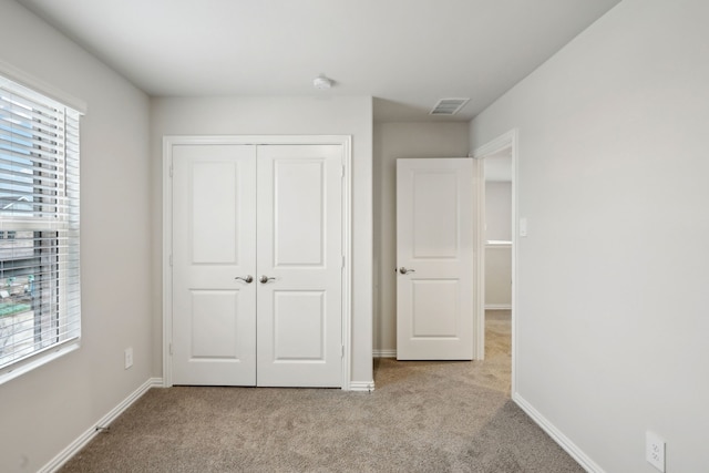 419 Bertney Dr, Princeton, TX 75071 - unfurnished bedroom featuring carpet, visible vents, and multiple windows