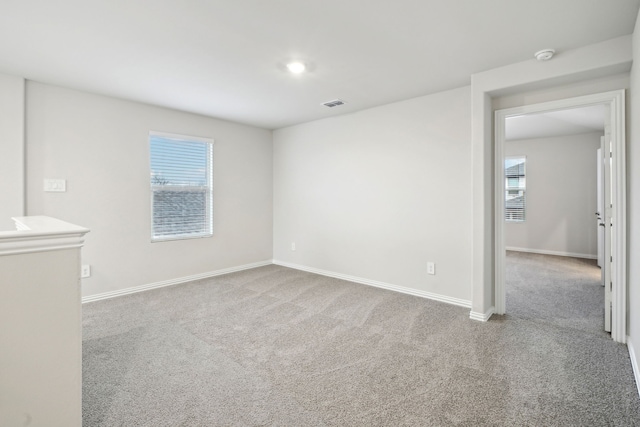 419 Bertney Dr, Princeton, TX 75071 - spare room with baseboards, visible vents, a healthy amount of sunlight, and carpet flooring