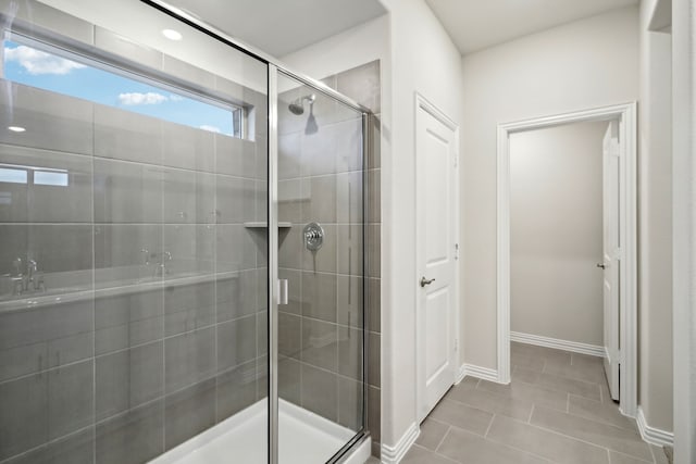 419 Bertney Dr, Princeton, TX 75071 - bathroom featuring a stall shower, tile patterned flooring, and baseboards