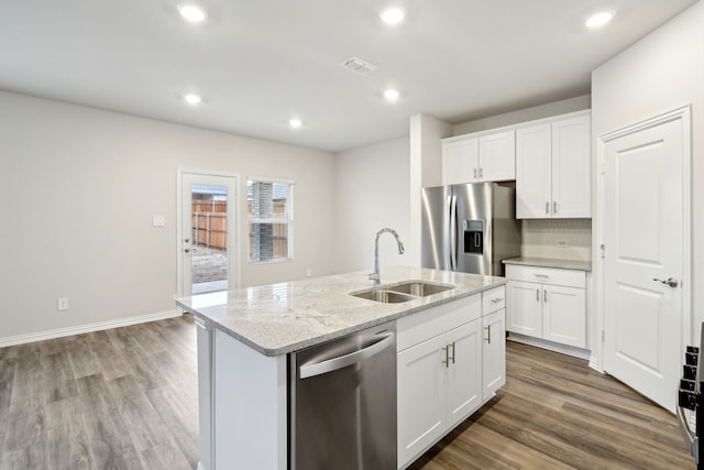 419 Bertney Dr, Princeton, TX 75071 - kitchen with dark wood-style flooring, a sink, appliances with stainless steel finishes, and visible vents