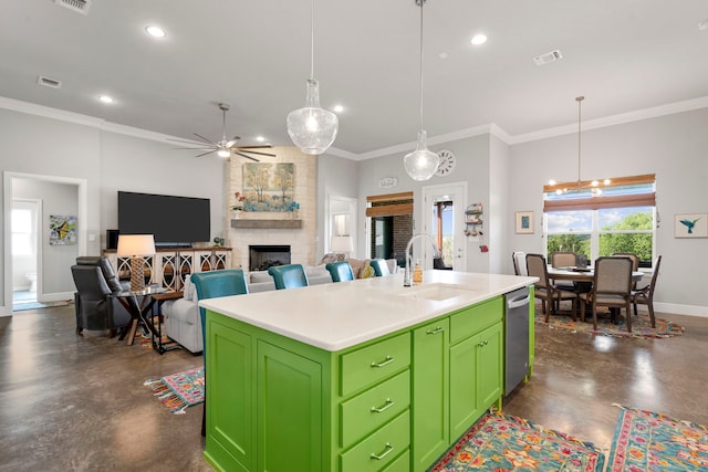 kitchen with green cabinetry, concrete floors, a sink, and visible vents