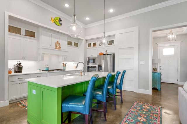 kitchen with a kitchen island with sink, a sink, stainless steel appliances, concrete floors, and light countertops