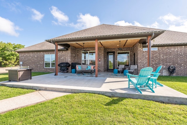 view of patio with outdoor lounge area, ceiling fan, and area for grilling