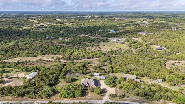 bird's eye view featuring a forest view