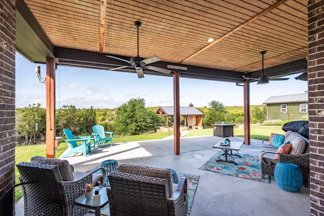 view of patio featuring an outdoor living space and a ceiling fan