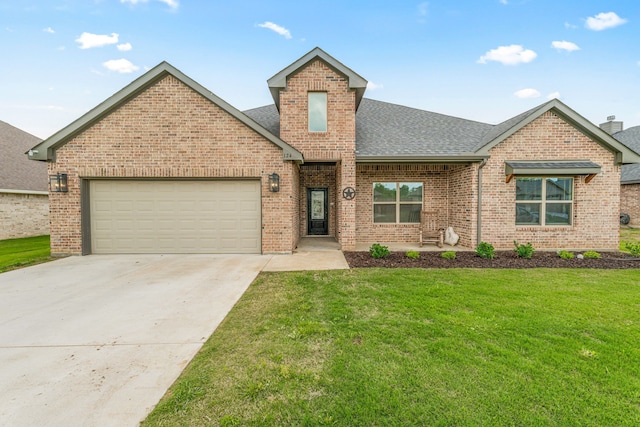 view of front facade featuring a front lawn, a garage, brick siding, concrete driveway, and roof with shingles
