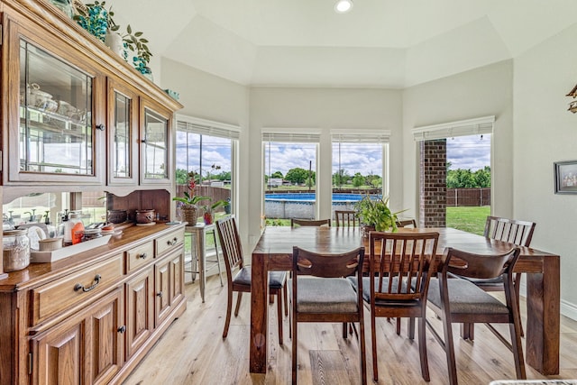 dining room with baseboards, recessed lighting, and light wood finished floors