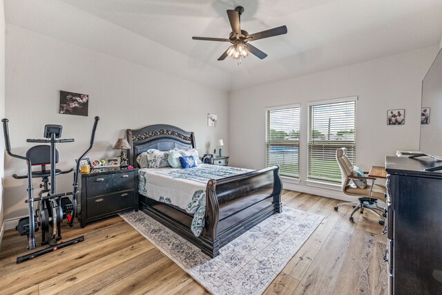 bedroom with ceiling fan and light wood-style flooring